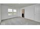 Spacious bedroom with a neutral carpet and walk-in closet at 1943 Black Oak Dr, Shelbyville, IN 46176