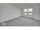 Spacious bedroom with a neutral carpet and plenty of natural light at 1943 Black Oak Dr, Shelbyville, IN 46176