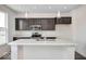 Bright kitchen boasts white marble countertops and stainless steel appliances at 1943 Black Oak Dr, Shelbyville, IN 46176