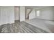 Open concept living area with carpet and hard surface flooring, a staircase, and neutral paint at 1943 Black Oak Dr, Shelbyville, IN 46176