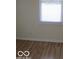 Bright bedroom featuring hardwood flooring and a window letting in natural light at 201 W Essex St, Lebanon, IN 46052