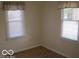 Bright bedroom featuring two windows with blinds at 201 W Essex St, Lebanon, IN 46052
