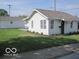 Quaint single-Gathering home featuring clean white siding, a well-kept lawn, and a detached garage at 201 W Essex St, Lebanon, IN 46052