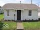 Charming home with manicured lawn, well-maintained landscaping, and a welcoming entrance at 201 W Essex St, Lebanon, IN 46052