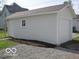 White garage with a side entry door and an overhead garage door at 201 W Essex St, Lebanon, IN 46052