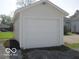 White garage with an overhead garage door provides secure parking at 201 W Essex St, Lebanon, IN 46052
