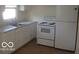 Well-lit kitchen featuring stainless steel appliances and white cabinetry at 201 W Essex St, Lebanon, IN 46052