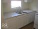 Kitchen area with updated cabinets and countertops at 201 W Essex St, Lebanon, IN 46052