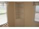 Living room featuring a built-in corner cabinet and large windows at 201 W Essex St, Lebanon, IN 46052