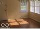Bright living room featuring hardwood floors and windows allowing natural light at 201 W Essex St, Lebanon, IN 46052
