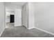 Bedroom with a closet, view of the kitchen through the doorway, and neutral walls with carpet flooring at 2030 Houston St, Indianapolis, IN 46218