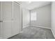 Bedroom with a closet, a window bringing in natural light, and neutral walls with carpet flooring at 2030 Houston St, Indianapolis, IN 46218
