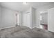 Spacious bedroom featuring gray carpet, a closet, and doorways to the bathroom and hallway at 2030 Houston St, Indianapolis, IN 46218