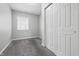 Bedroom with a closet, a window bringing in natural light, and neutral walls with carpet flooring at 2030 Houston St, Indianapolis, IN 46218
