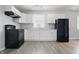 Updated kitchen with white cabinets, modern appliances, and ample counter space for cooking at 2030 Houston St, Indianapolis, IN 46218