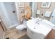 Bright bathroom featuring a neutral color scheme, shower, toilet, and white vanity at 232 S Audubon Rd, Indianapolis, IN 46219
