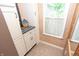 Bathroom features include a built-in vanity, granite countertops, and great natural light at 232 S Audubon Rd, Indianapolis, IN 46219