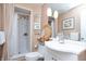 Bright bathroom with a neutral color palette with a shower and modern vanity at 232 S Audubon Rd, Indianapolis, IN 46219
