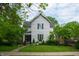 Charming two-story home with a landscaped front yard and inviting porch at 232 S Audubon Rd, Indianapolis, IN 46219