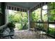 Charming front porch with comfortable seating and decorative rug, perfect for relaxation at 232 S Audubon Rd, Indianapolis, IN 46219
