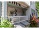Cozy front porch with decorative shutters, a white railing and charming accents, perfect for relaxing at 232 S Audubon Rd, Indianapolis, IN 46219