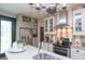 Spacious kitchen featuring stainless steel appliances, light cabinetry, and a decorative chandelier at 232 S Audubon Rd, Indianapolis, IN 46219