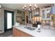 Well-lit kitchen featuring stainless steel appliances, island sink, and bright counter tops at 232 S Audubon Rd, Indianapolis, IN 46219