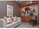 Comfortable living room featuring stylish decor, a cozy sofa, and unique art at 232 S Audubon Rd, Indianapolis, IN 46219