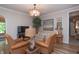 Relaxing living room with a large window, cozy seating, and soft, neutral tones at 232 S Audubon Rd, Indianapolis, IN 46219