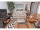Comfortable living room featuring a sofa, armchairs, TV, and neutral decor at 232 S Audubon Rd, Indianapolis, IN 46219