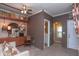 Stylish living room with wood accent wall, transitional furniture, and connecting bathroom and entrance at 232 S Audubon Rd, Indianapolis, IN 46219