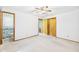 Cozy bedroom with closet, ceiling fan, and a view of a connecting bathroom at 25 N Mustin Dr, Anderson, IN 46012