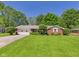 Charming brick ranch home with a well-manicured lawn and two-car garage at 25 N Mustin Dr, Anderson, IN 46012