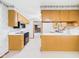 Spacious kitchen with oak cabinets, white countertops, and black appliances at 25 N Mustin Dr, Anderson, IN 46012