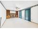 Bright and airy living room with a brick fireplace and built in wooden bookshelves at 25 N Mustin Dr, Anderson, IN 46012