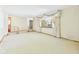 Bright living room with plush carpeting, large window, and decorative accents at 25 N Mustin Dr, Anderson, IN 46012