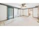 Spacious living room with a glass door to the backyard and carpeted floors at 25 N Mustin Dr, Anderson, IN 46012