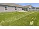 Large backyard with a covered patio, perfect for outdoor entertaining and relaxation at 2913 Lily Dr, Lebanon, IN 46052