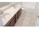 Bathroom featuring double sink vanity, granite counters, and a shower-tub combo at 2913 Lily Dr, Lebanon, IN 46052