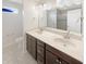 Bathroom with a double sink vanity, modern fixtures, and a tile-enclosed shower at 2913 Lily Dr, Lebanon, IN 46052