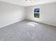Bright bedroom featuring neutral walls, carpet flooring, and a window offering natural light at 2913 Lily Dr, Lebanon, IN 46052