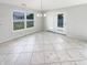 Bright dining room with tile floors, access to the backyard, and modern light fixture at 2913 Lily Dr, Lebanon, IN 46052