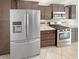Kitchen with stainless steel appliances and brown cabinets at 2913 Lily Dr, Lebanon, IN 46052