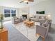 Bright and airy living room with large windows, stylish decor, and cozy seating at 2913 Lily Dr, Lebanon, IN 46052