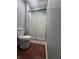 This bathroom features a toilet and glass shower at 3055 Pawnee Dr, Indianapolis, IN 46235
