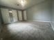 This bedroom offers carpet and multiple doors at 3055 Pawnee Dr, Indianapolis, IN 46235
