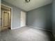 This bedroom offers carpet and a window providing natural light at 3055 Pawnee Dr, Indianapolis, IN 46235