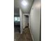 Hallway featuring neutral painted walls, carpet flooring, and view to a bedroom at 3055 Pawnee Dr, Indianapolis, IN 46235