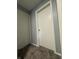 The hallway offers carpet floors and white doors at 3055 Pawnee Dr, Indianapolis, IN 46235