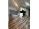 A kitchen with white cabinets, stainless steel appliances, and hardwood floors at 3055 Pawnee Dr, Indianapolis, IN 46235